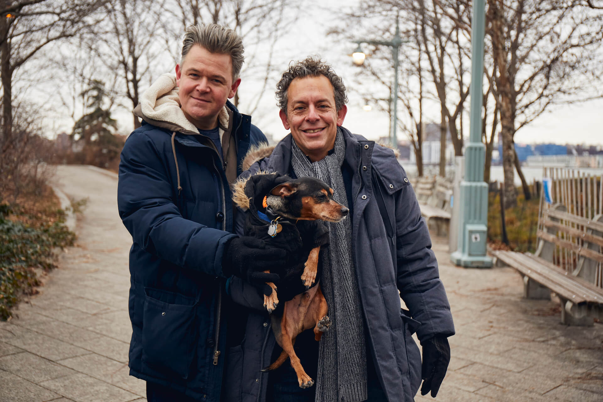Tony and his partner with their dog in the park